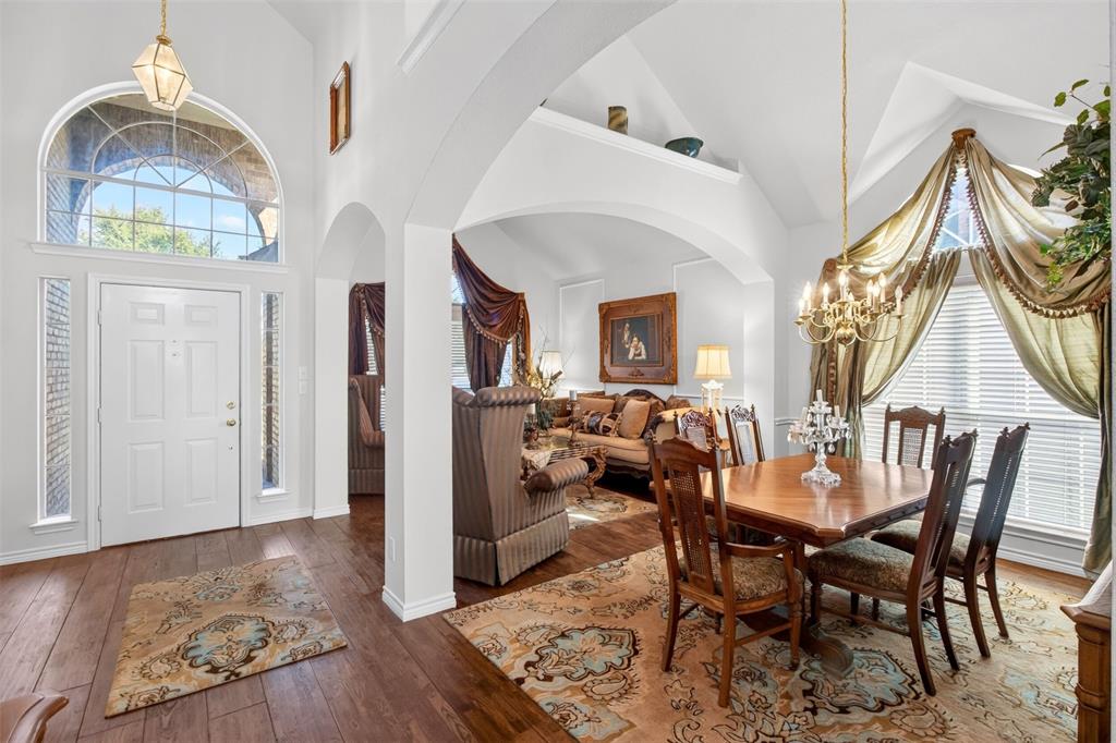 Formal living and dining spaces with high ceilings, architectural arches and large windows. Formal living and dining spaces with high ceilings, architectural arches and large windows.