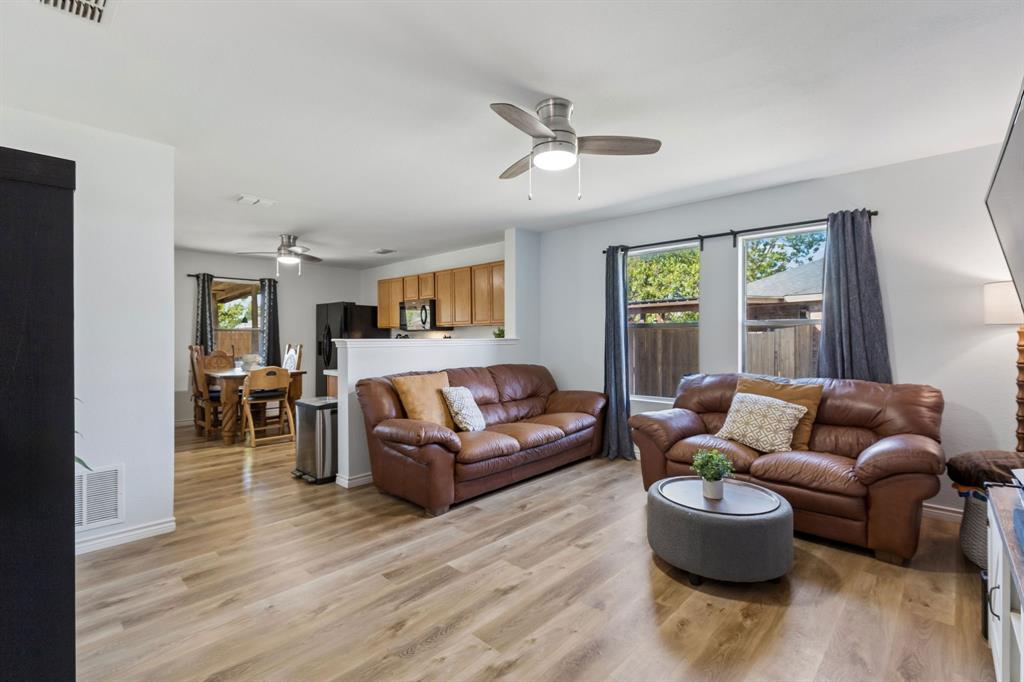 Welcome to the spacious living room. Featuring, LVP flooring, updated ceiling fan and large windows giving off lots of natural light. Welcome to the spacious living room. Featuring, LVP flooring, updated ceiling fan and large windows giving off lots of natural light.