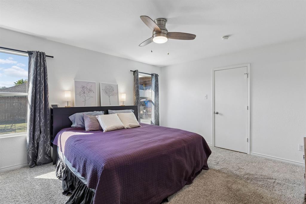The primary bedroom features a private ensuite bathroom and a spacious walk-in closet.
