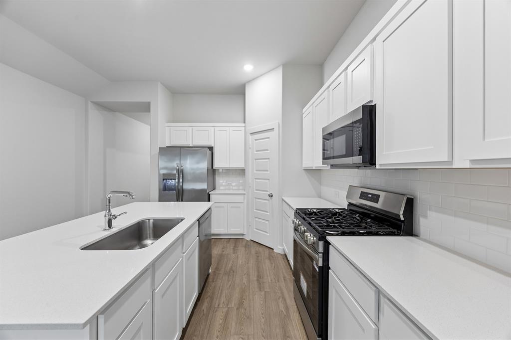 Kitchen in the Cedar home plan – REPRESENTATIVE PHOTO Kitchen in the Cedar home plan – REPRESENTATIVE PHOTO