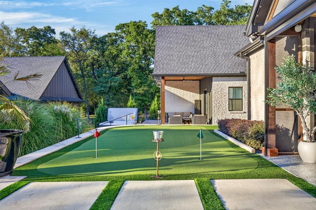 Four-hole putting green offers another recreational feature just steps from the main home.