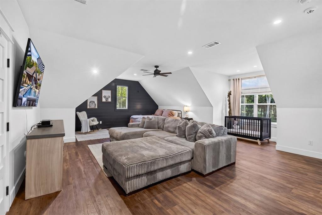Upstairs bonus living area offering flexible space for a game room, media room, or additional living area. Full Bath with Tub & Tile shower serves the upstairs bedroom. Main Residence.