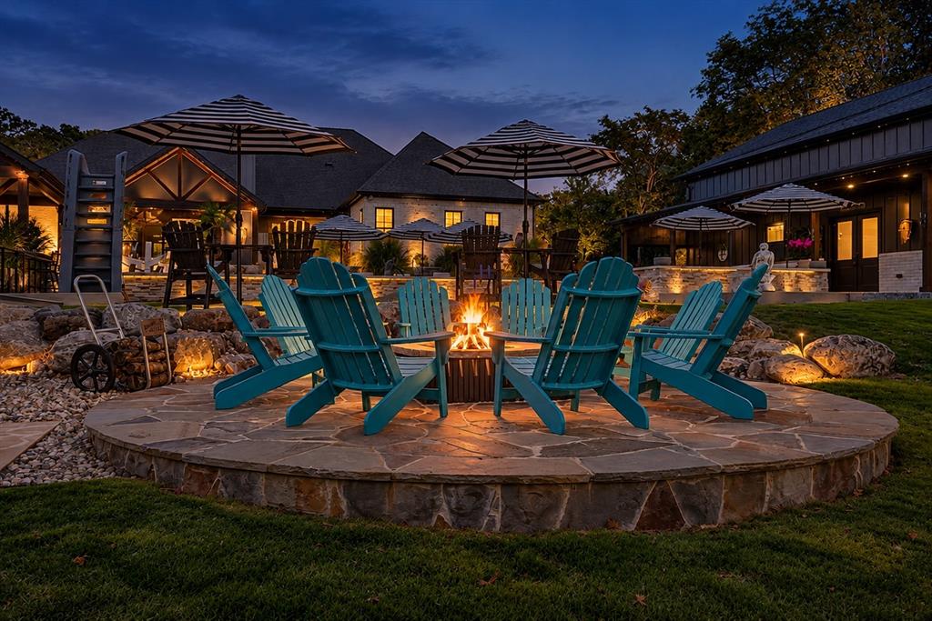 Gas-start flagstone fire pit provides an additional gathering area overlooking the beautifully landscaped grounds.