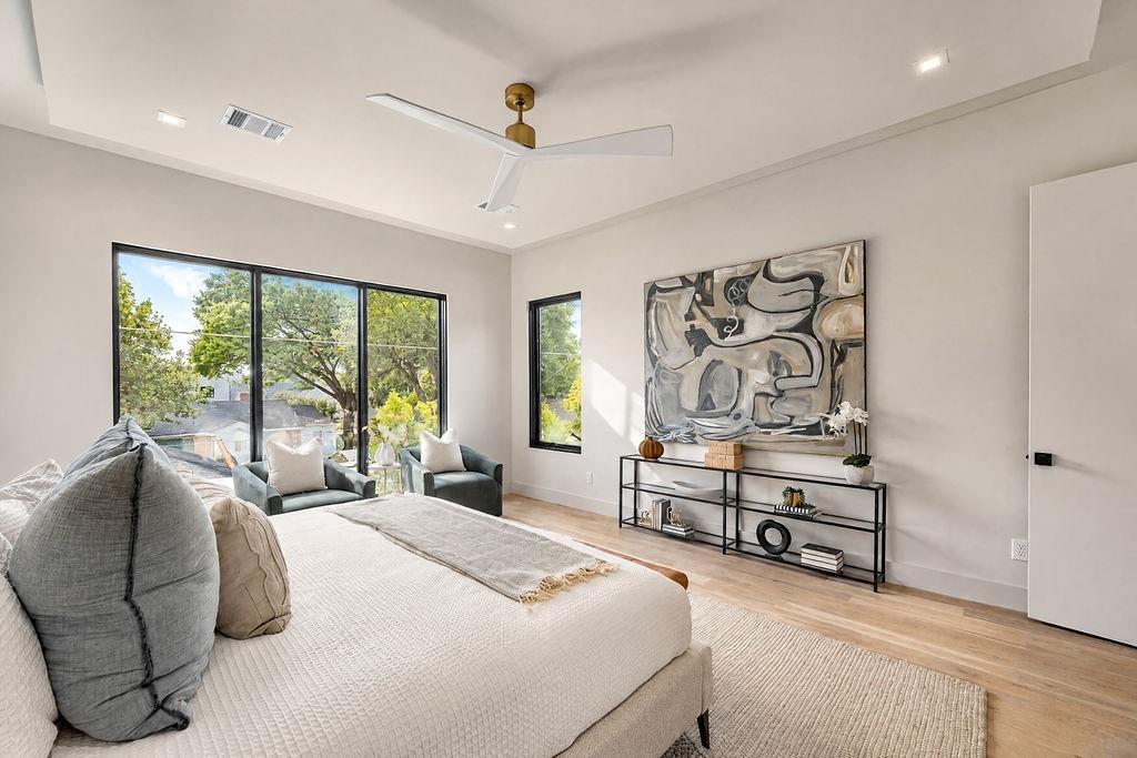 Enjoy a quiet moment with a good book in your bedroom sitting area as morning light fills the space