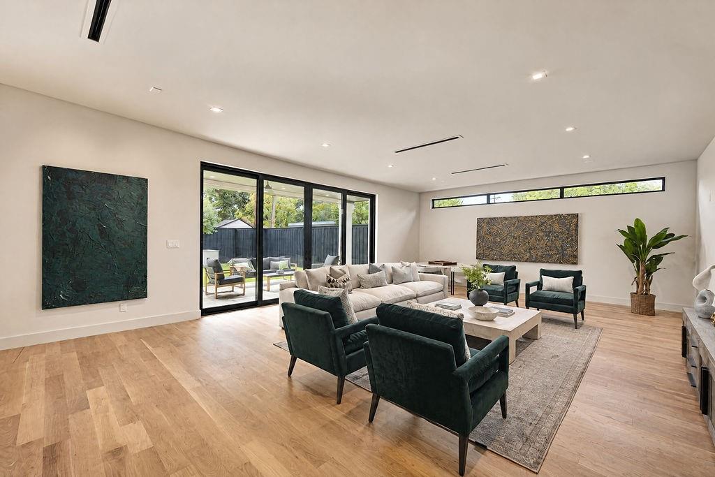 Settle in for relaxed afternoon reading or lively game nights in this secondary living space that opens directly to the back patio