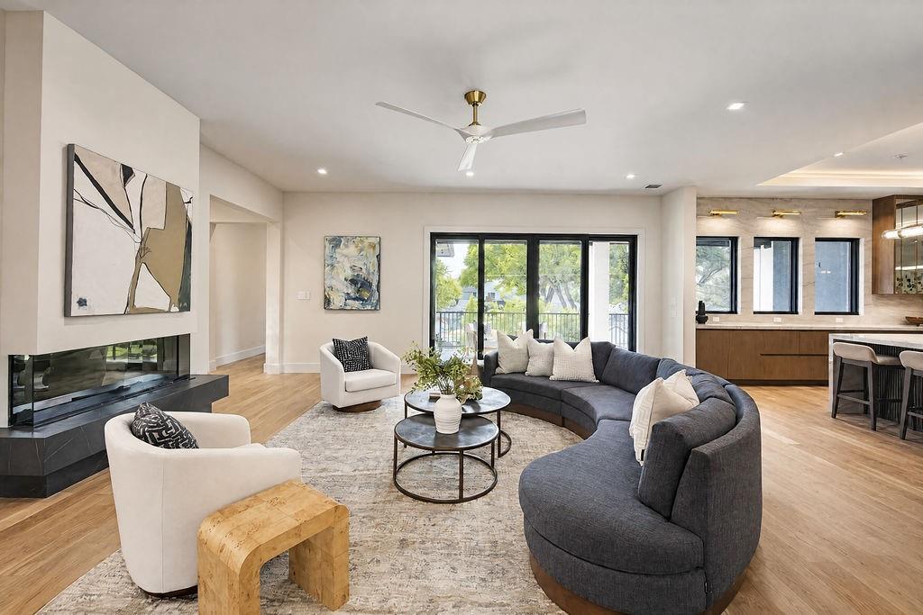 Cozy up by the custom electric fireplace in the upper living room on cool evenings, or slide open the patio doors for a fresh breeze