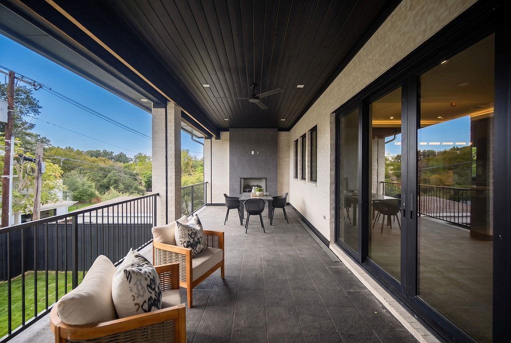 Sip your morning coffee or evening wine on the covered balcony, keeping warm by the outdoor fireplace