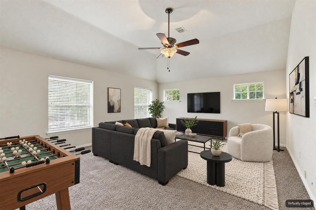 Virtually staged upstairs game room.