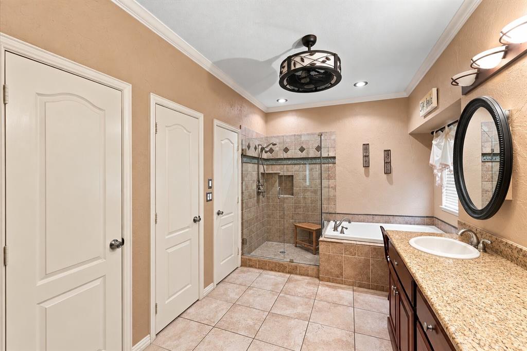 Primary bathroom with linen closet, water closet for toilet and first of two closets!