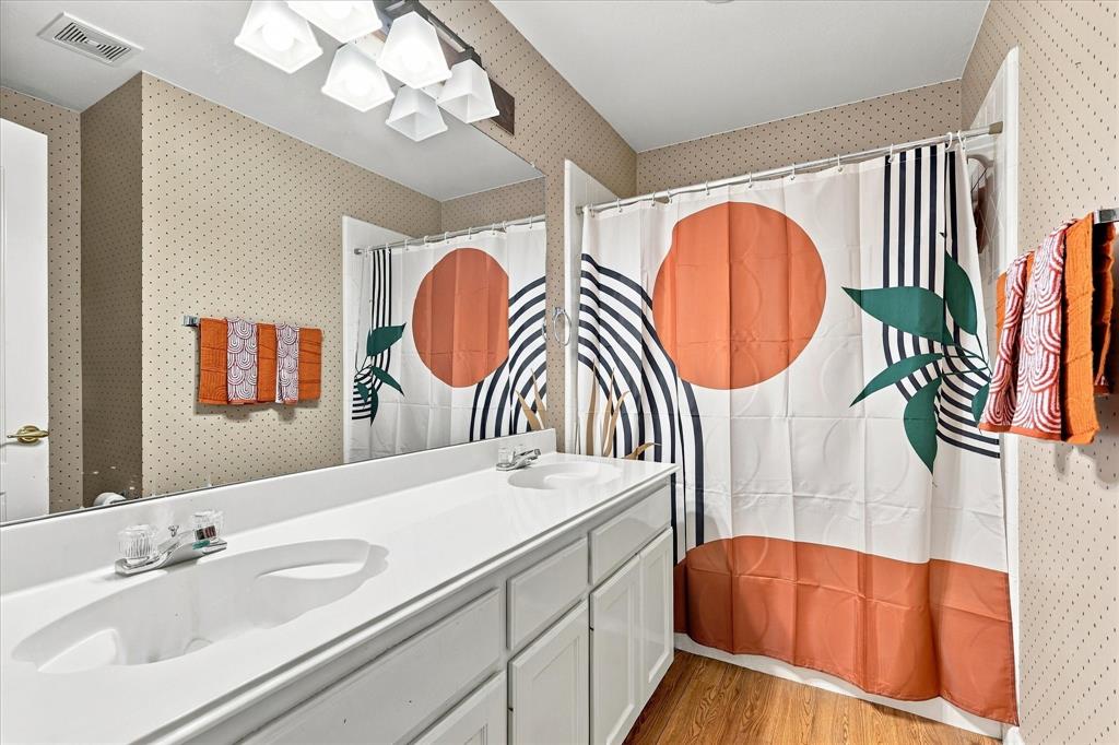 Upstairs bathroom with tub shower combo.