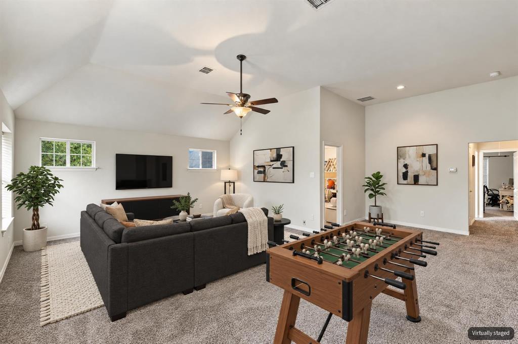 Virtually staged upstairs game room.