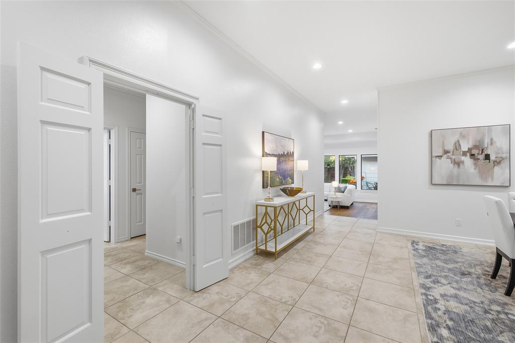 Double doors close off the secondary bedroom wing for quiet and privacy, with the living room just beyond.