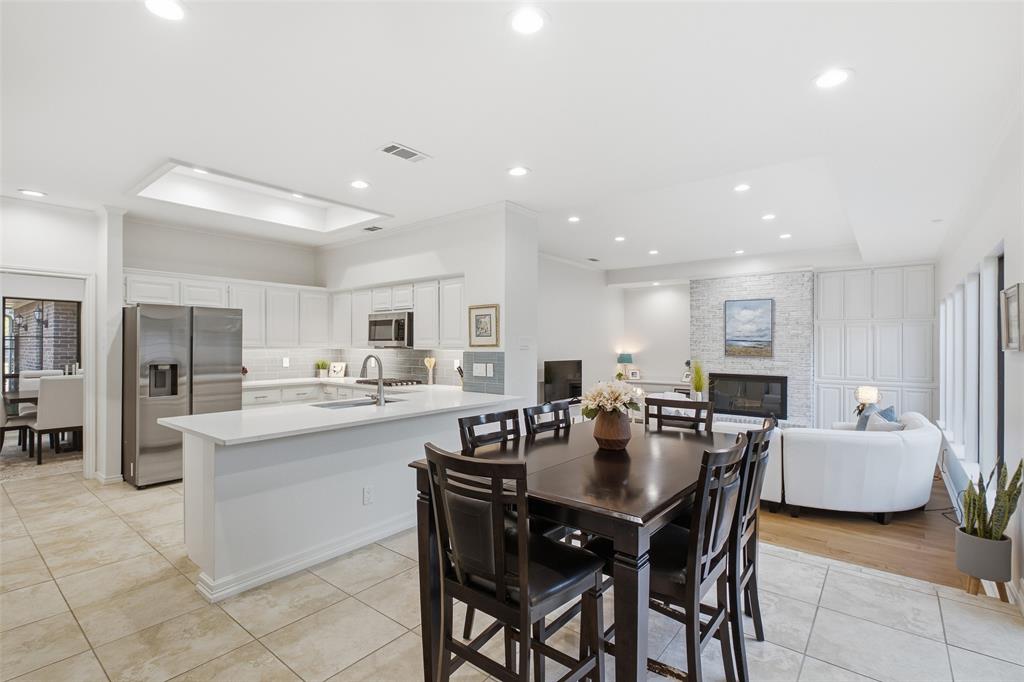 Kitchen, nook, and living room connect in one open sightline—made for hosting a crowd or a quiet night in.