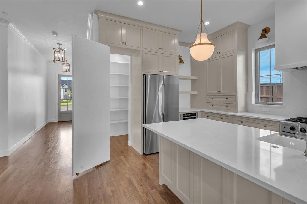 Cabinet front provides hidden access to pantry