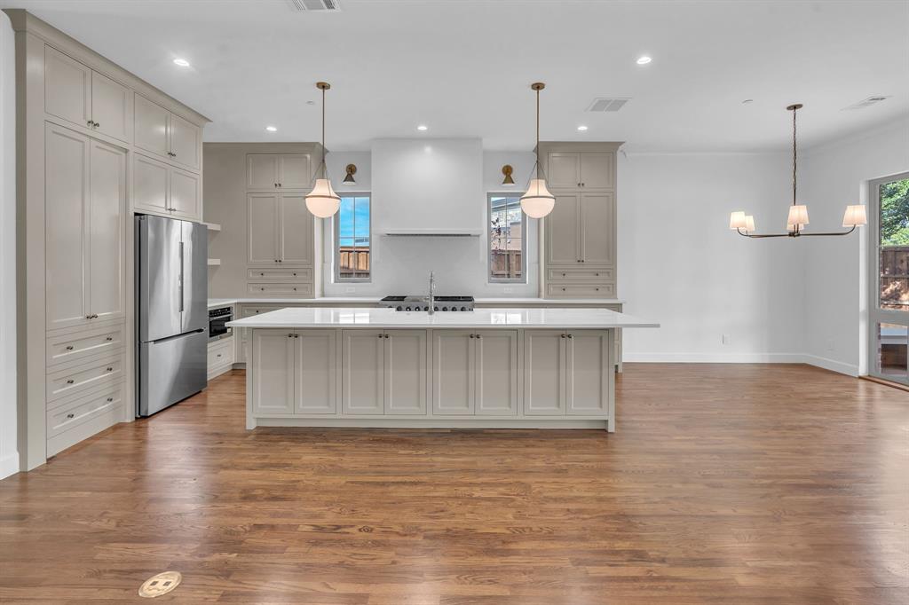 Neutral finishes, custom fixtures, real wood floors