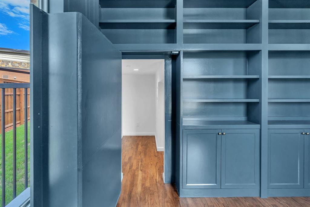 Hidden door in bookcase leads to under stair storage room