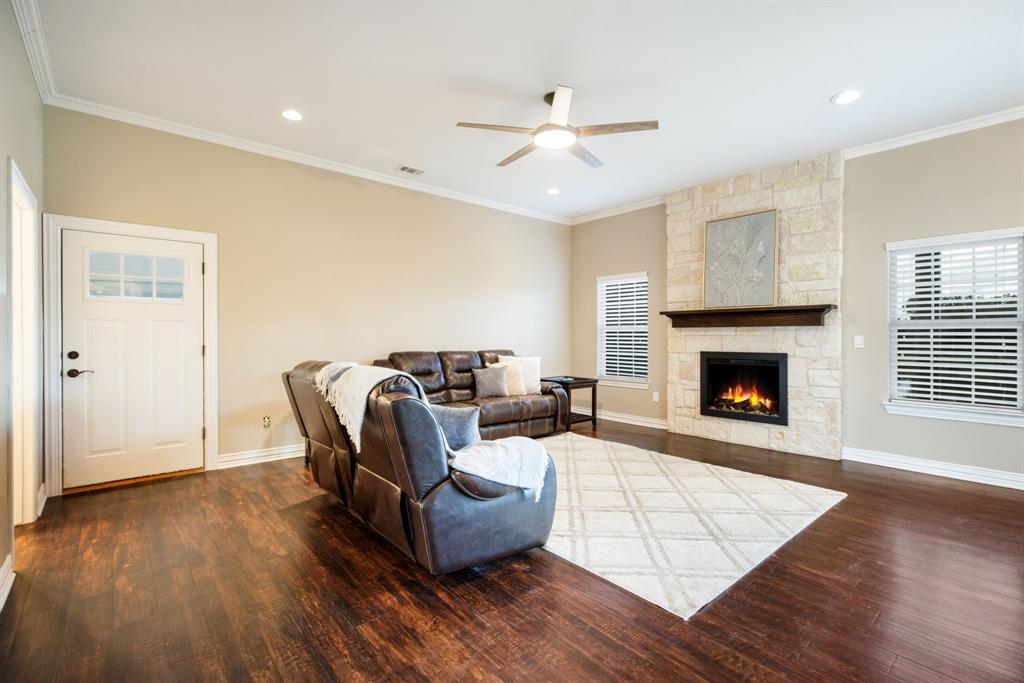 Living space flows from kitchen and two dinning spaces with sliding doors that lead to a covered patio.