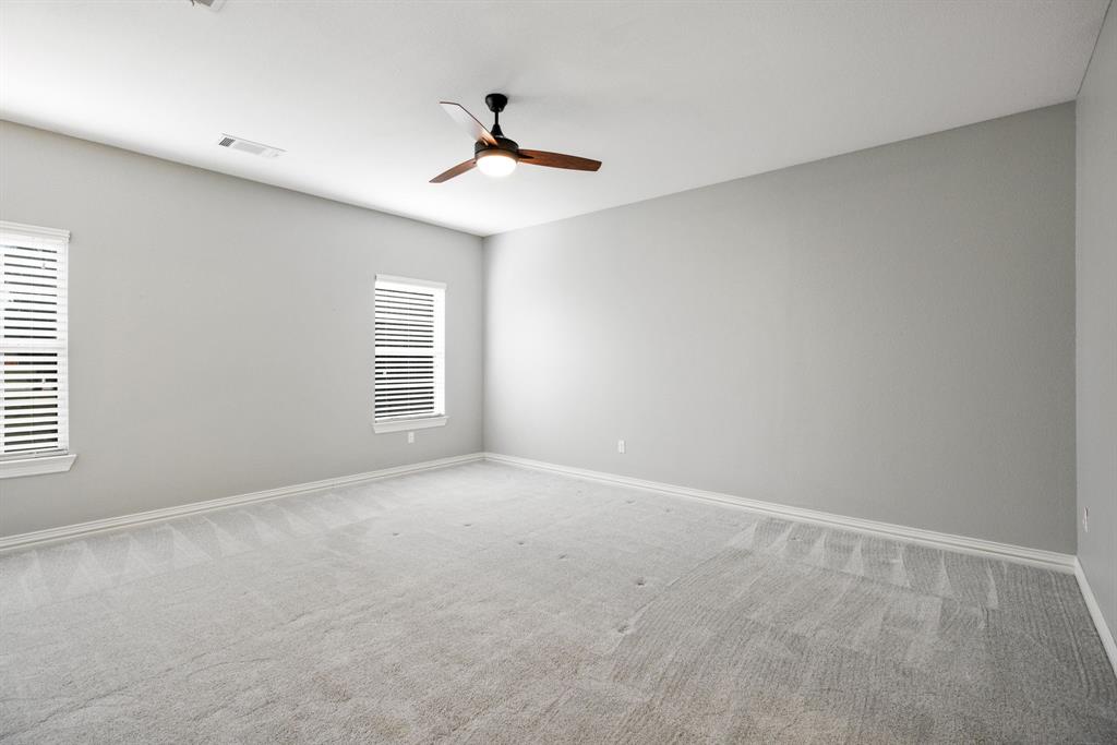 Enjoy the elegant palette choice of the primary suite with a designated sitting area.