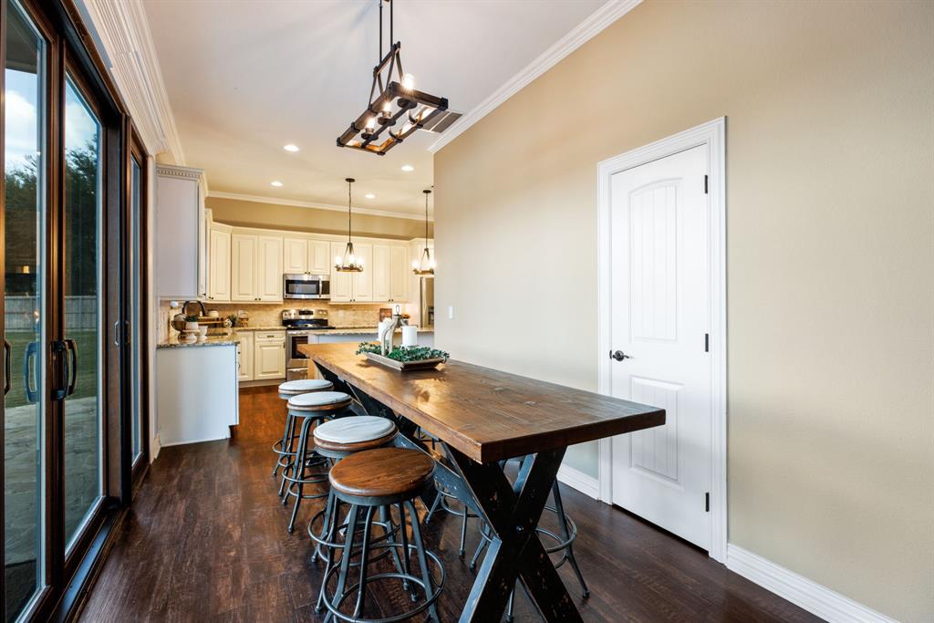Guests can mingle effortlessly between the formal dining room, casual breakfast nook, and the spacious kitchen island.