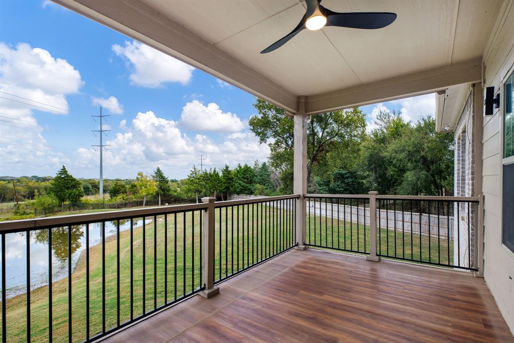 Upstairs deck overlooking the backyard and pool.  Enter off the oversized living space.