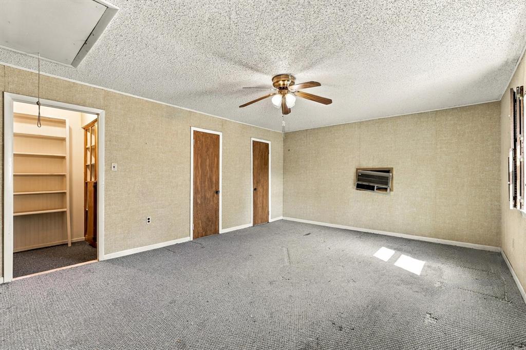 Bedroom or bonus/flex room. 3 closets! The closet on the left does have plumbing that can be connected to create an additional bathroom or kitchenette.