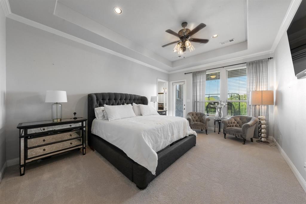 Tray ceiling featuring recessed lighting and a central ceiling fan with integrated light fixtures
