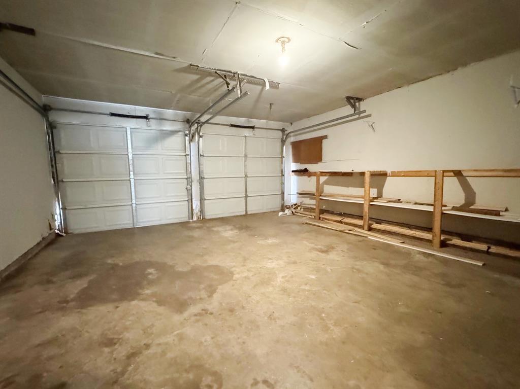 View of garage from laundry room and kitchen