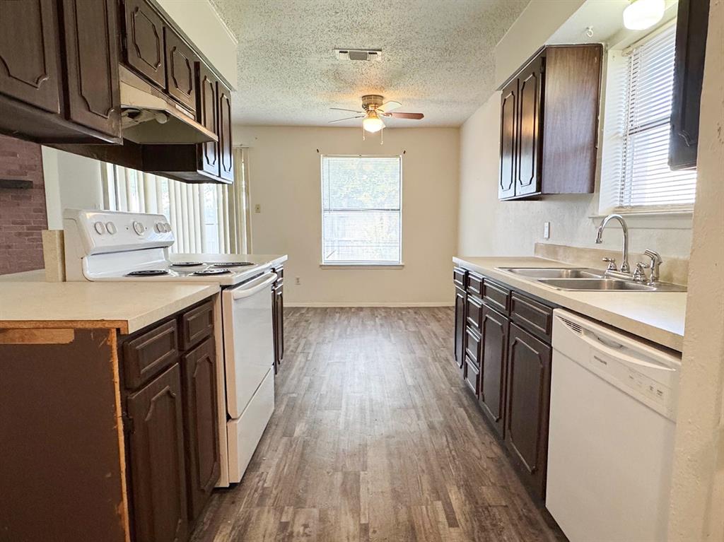 View of kitchen from laundry room and garage
