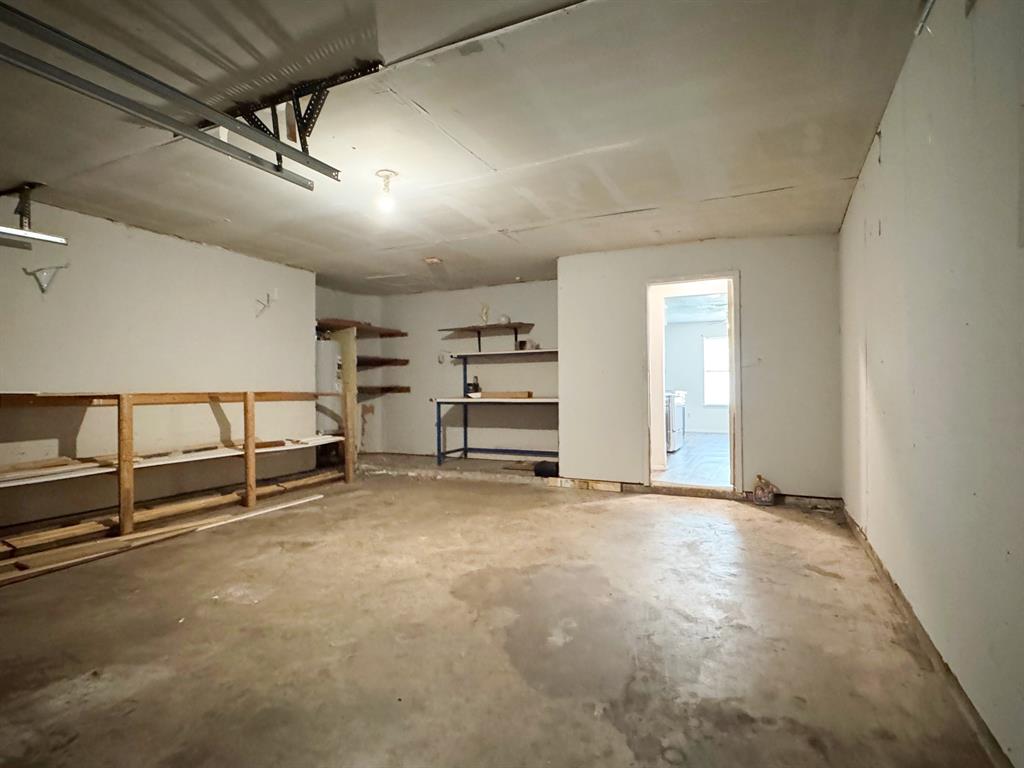 Garage looking into laundry room and kitchen