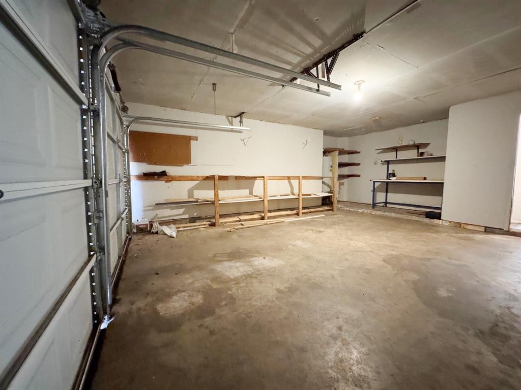 Garage showing work bench and storage area