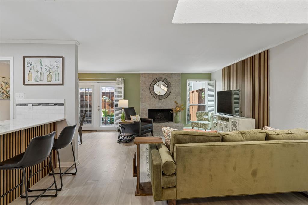 Living room opens to updated kitchen & dining