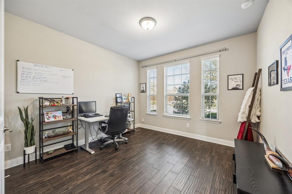 Guest bedroom currently being utilized as an additional office.