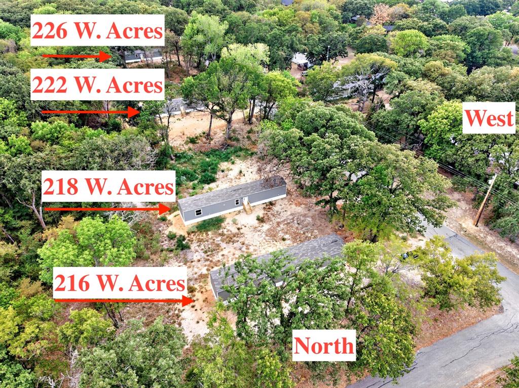 Aerial view of multi-lot property featuring mature trees and expansive foliage