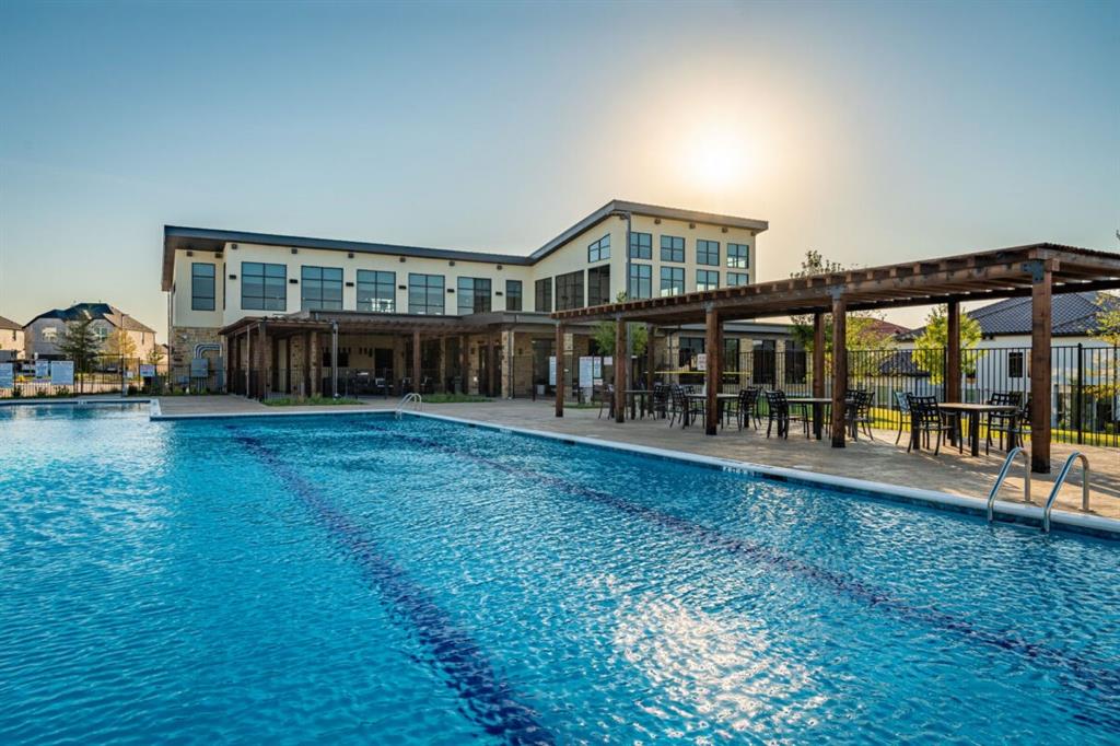 LEXINGTON Community Swimming pool featuring lane markings, stone-paver decking, and a wood-frame pergola structure LEXINGTON Community Swimming pool featuring lane markings, stone-paver decking, and a wood-frame pergola structure