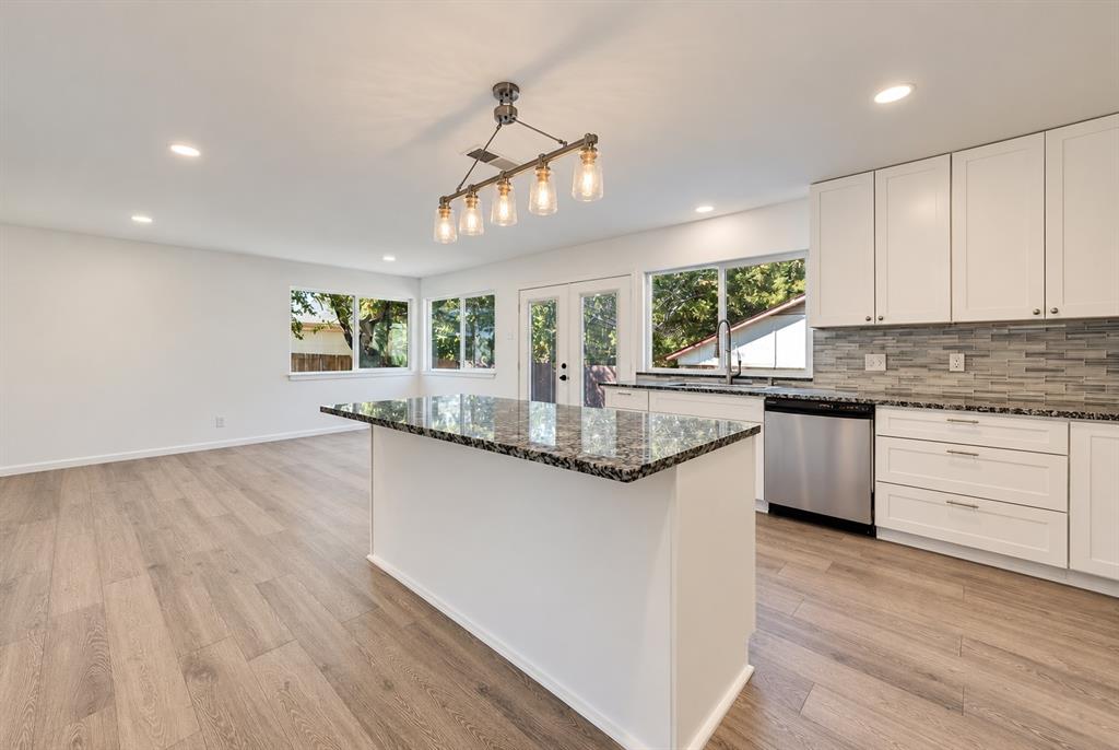Open kitchen with  flex-space as breakfast, dining or second living area.