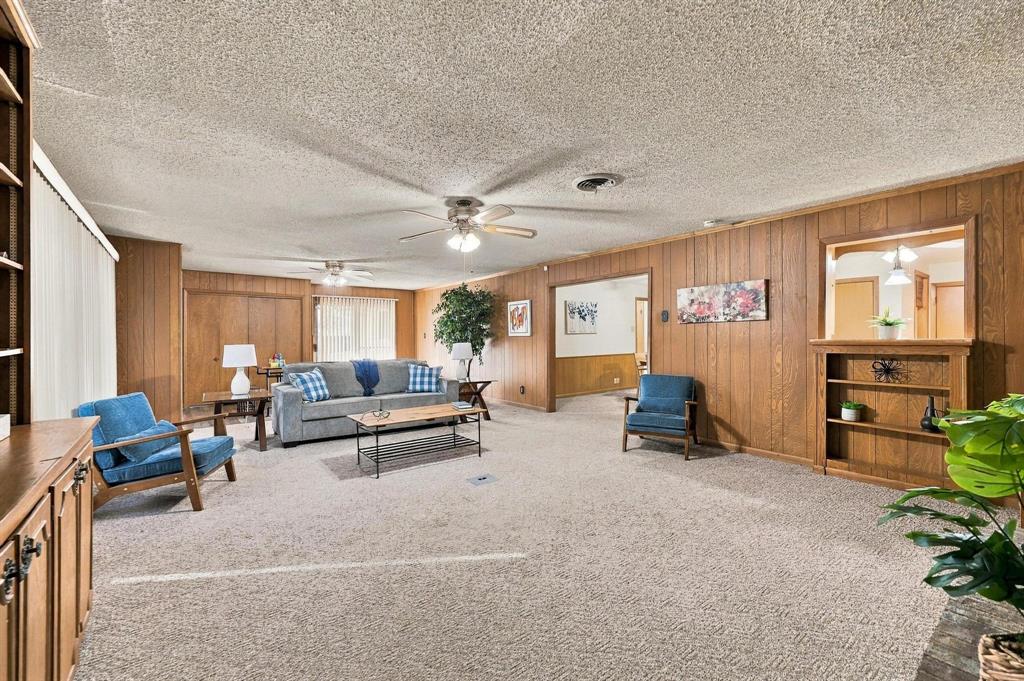 Wood paneling, with custom built in shelves and natural lighting