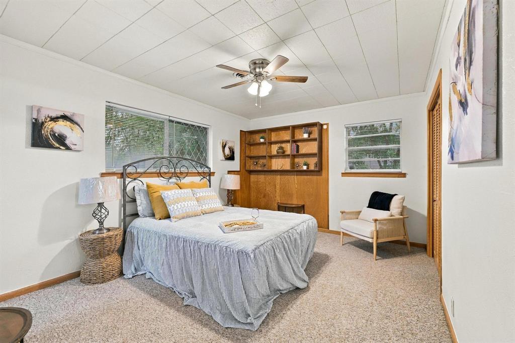 Built in cabinets, natural light with access to ensuite.