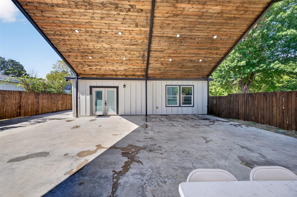 30X30 Covered patio with wood panel vaulted ceilings.