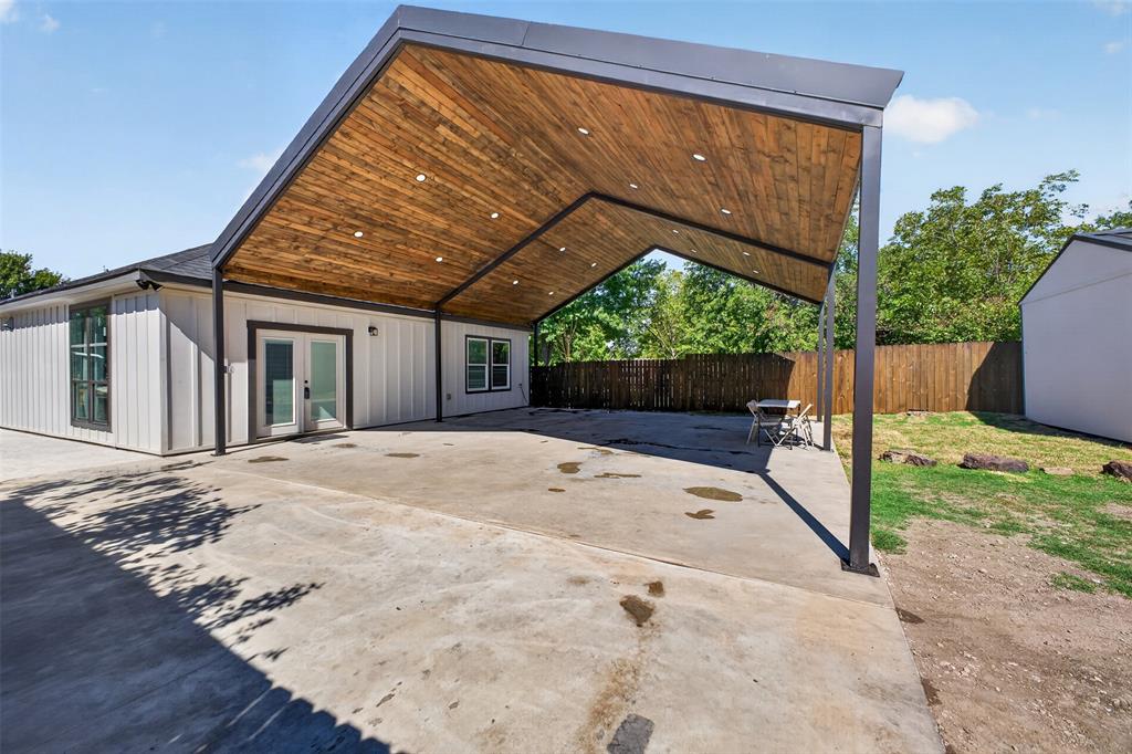 Brand New 30 X 30 covered patio with beautiful wood paneled vaulted ceilings, exposed beams, and recessed lighting. This impressive 900 sq foot space offers plenty of room for outdoor entertaining or covered parking up to four vehicles.