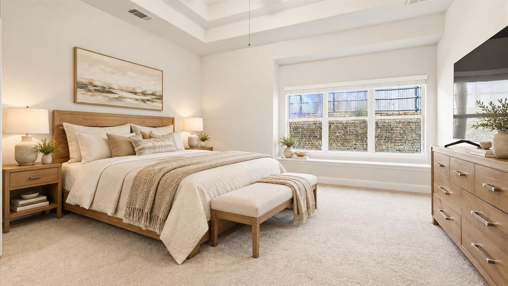 Tray ceiling, window seat with built-in ledge, and neutral wall-to-wall carpeting