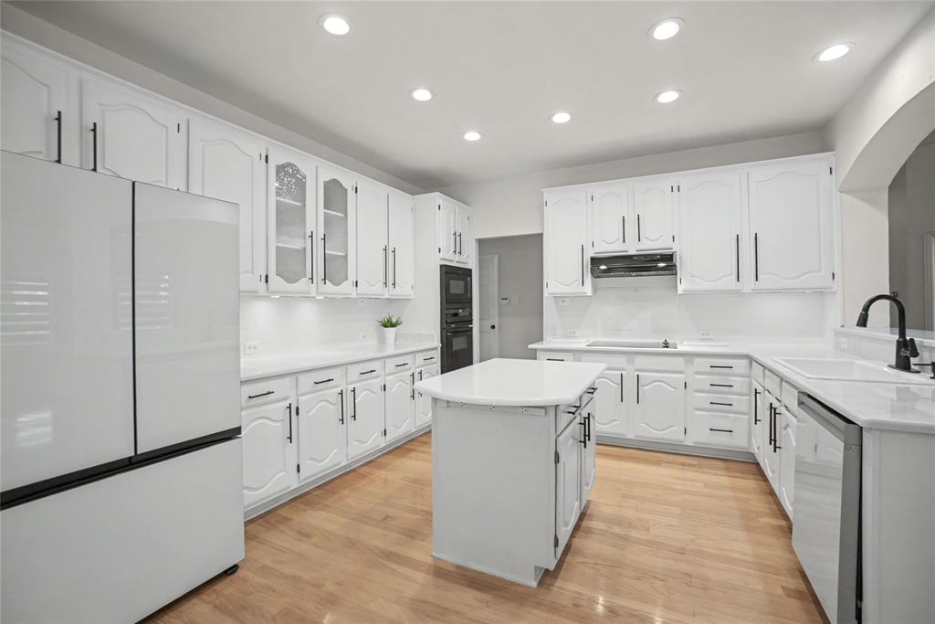 Installed designer quartz counter tops and white subway tile backsplashes. Soft white cabinetry with some glass displays and Black iron hardware. Includes recent Bespoke Refrigerator and Dishwasher. Installed designer quartz counter tops and white subway tile backsplashes. Soft white cabinetry with some glass displays and Black iron hardware. Includes recent Bespoke Refrigerator and Dishwasher.
