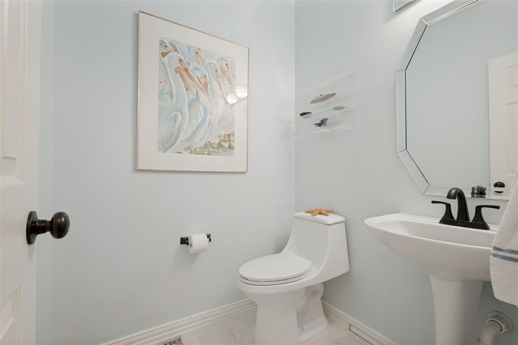 Downstairs half bathroom is located across from the 2nd bedroom.