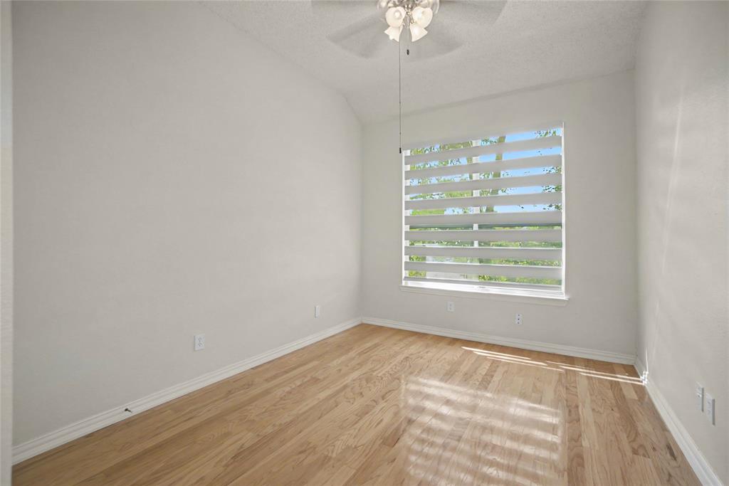 The 2nd Bedroom is downstairs with hardwoods, zebra blinds and closet.
