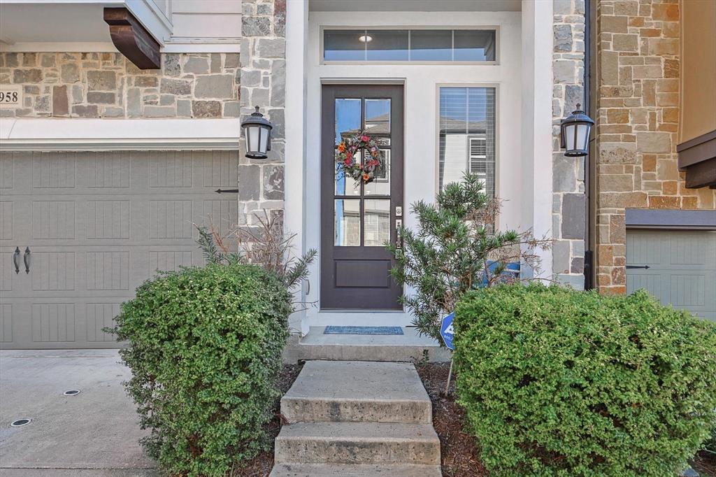 Doorway to property featuring a garage