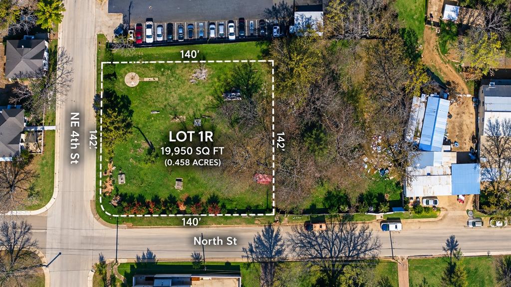 Corner lot spanning 19,950 square feet with established trees and direct street access Corner lot spanning 19,950 square feet with established trees and direct street access