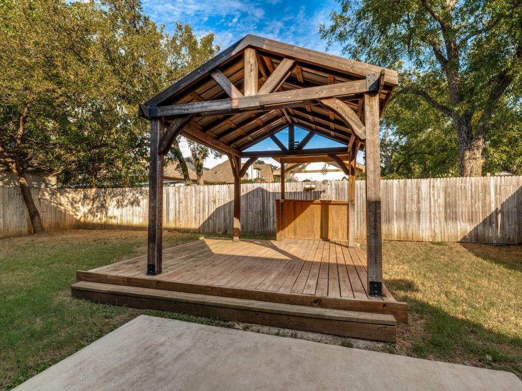 Beautiful wood gazebo with a built-in bar creates an inviting outdoor entertaining space.
