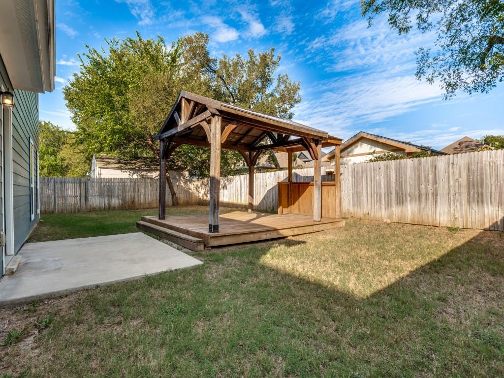 Oversized fenced backyard with a gazebo and plenty of space to relax, play, or entertain.