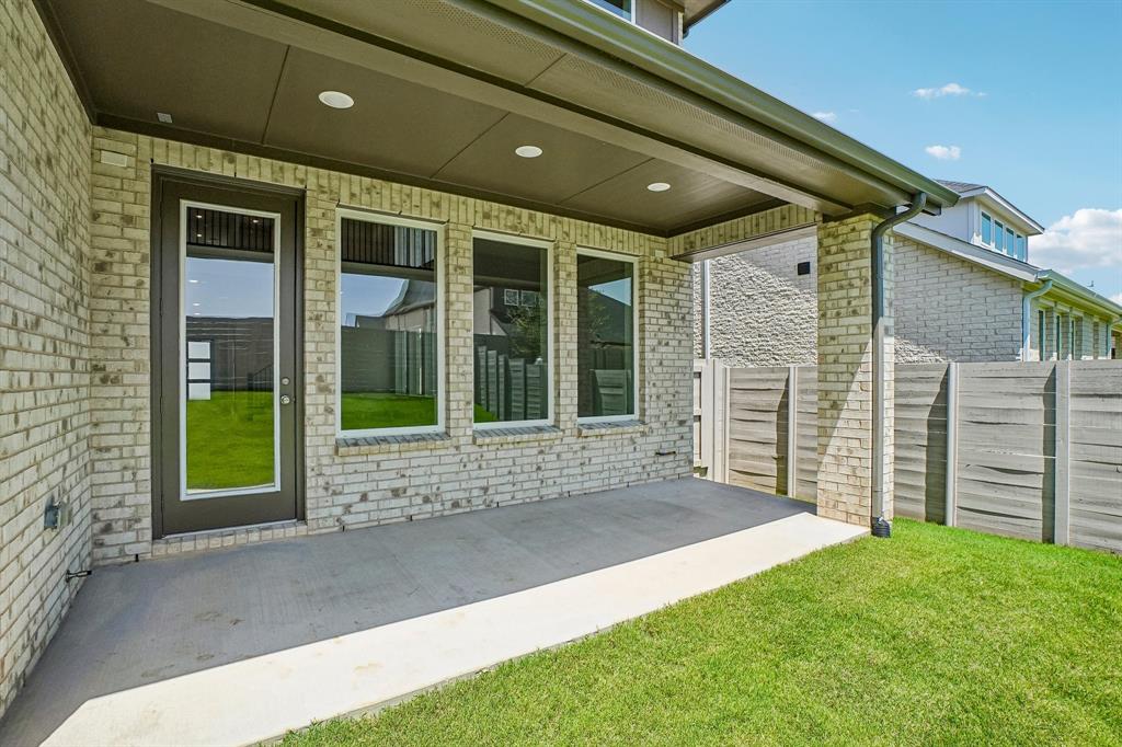 Dining al fresco is in your future on this lovely covered back patio!