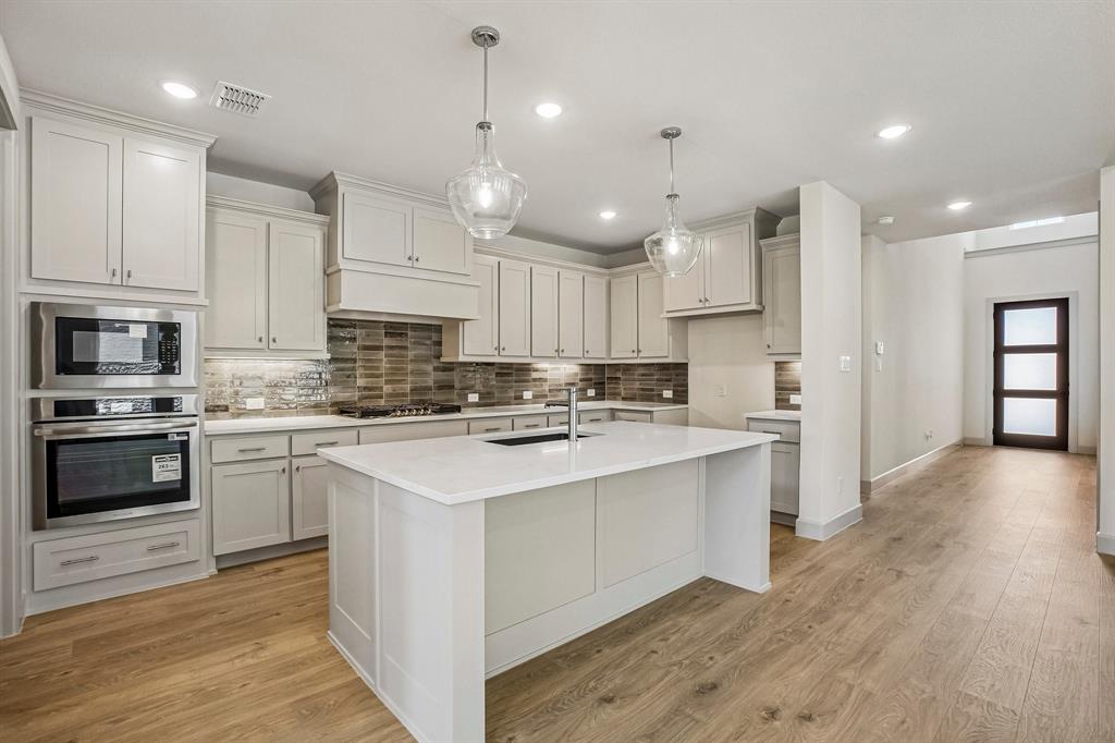 Featuring ample cabinetry and plenty of prep space, all the chefs in the family will love creating culinary delights in this dream kitchen!