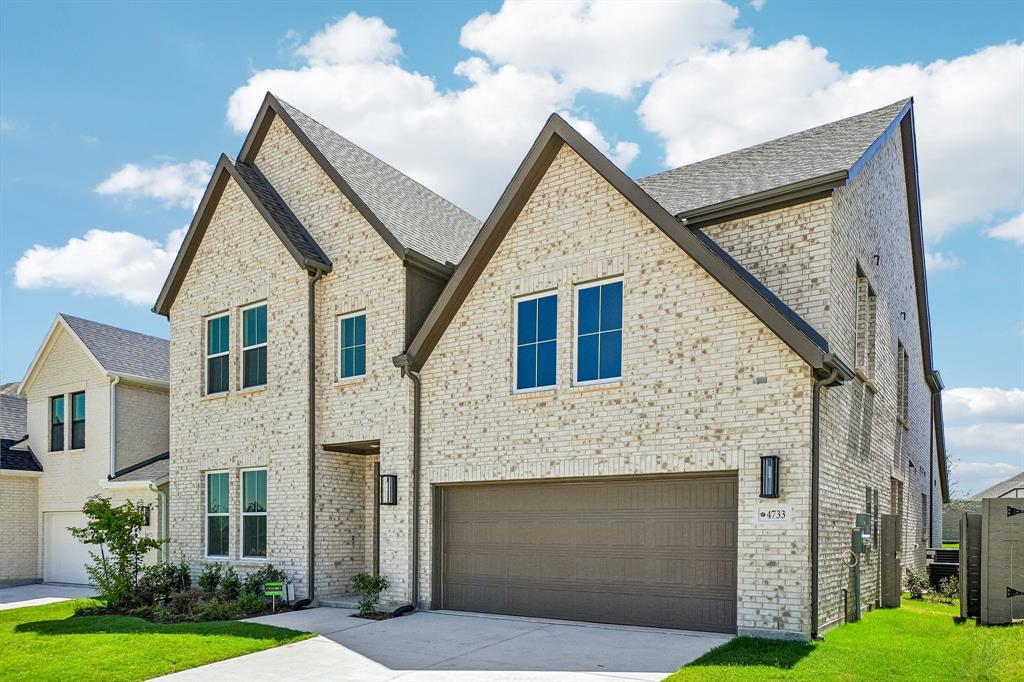 Dramatic gables, beautiful light colored brick and striking dark trim create outstanding curb appeal for this dream home!